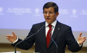 Turkey's Prime Minister Ahmet Davutoglu speaks during a meeting at his ruling AK Party headquarters in Ankara, Turkey, August 28, 2015. Davutoglu said he would present the list of names for an interim power-sharing cabinet to President Tayyip Erdogan later on Friday. The new cabinet, expected to include at least two names from the pro-Kurdish opposition HDP, will be tasked with leading Turkey to a snap parliamentary election on Nov. 1. REUTERS/Umit Bektas - RTX1Q0AN