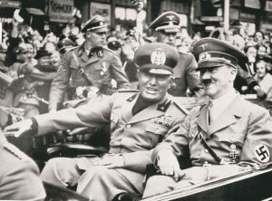 The AssocIated Press files In this Sept. 28, 1938, photo, Italian dictator Benito Mussolini (left) and Adolf Hitler take a ride before a conference in Munich, Germany.