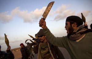 Libyan opposition rebel fighters with their weapons on the road in Bin Jawad, Libiya ,March 5,2011. photo by HEIDI LEVINE/SIPA PRESS