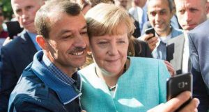 Merkel profughi salario ridotto