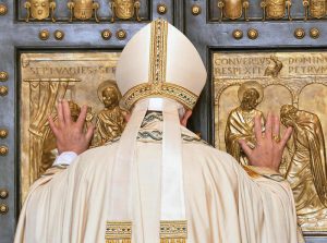 Pope Francis opens the Holy Door of Saint Peter's Basilica, formally starting the Jubilee of Mercy, at the Vatican City, 08 December 2015. ANSA/MAURIZIO BRAMBATTI