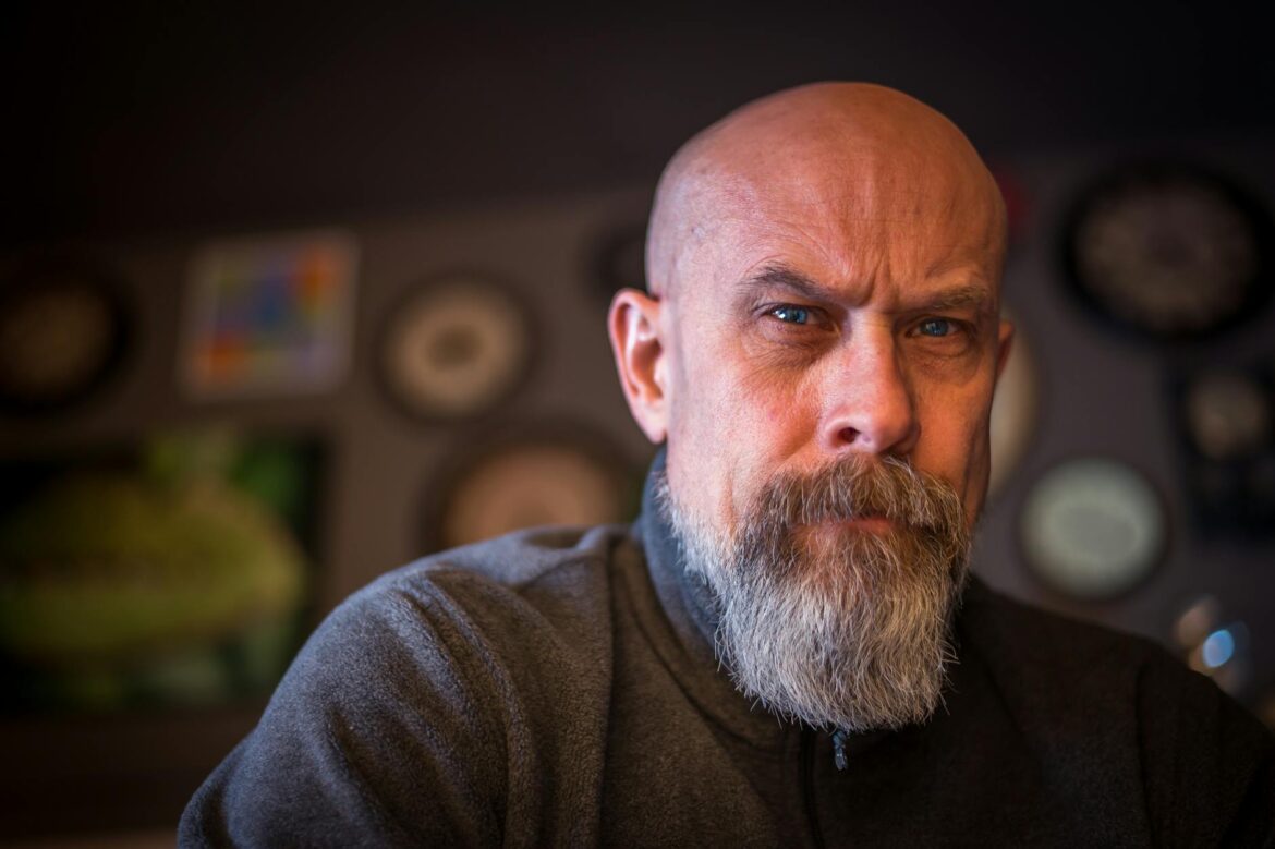 bearded man wearing gray sweatshirt