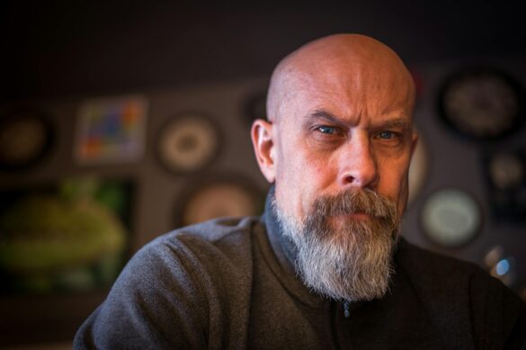 bearded man wearing gray sweatshirt