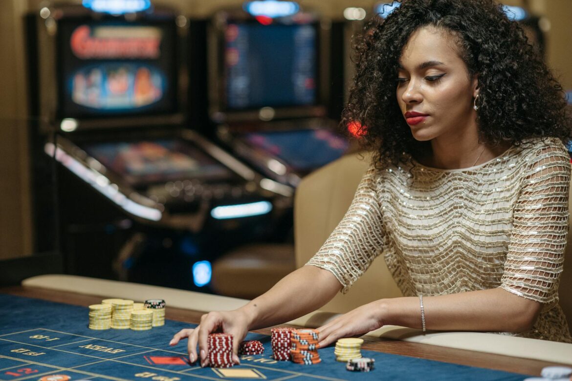 a woman betting a stack of chips on a gaming table