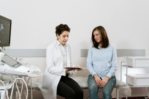 photo of pregnant woman having a consultation