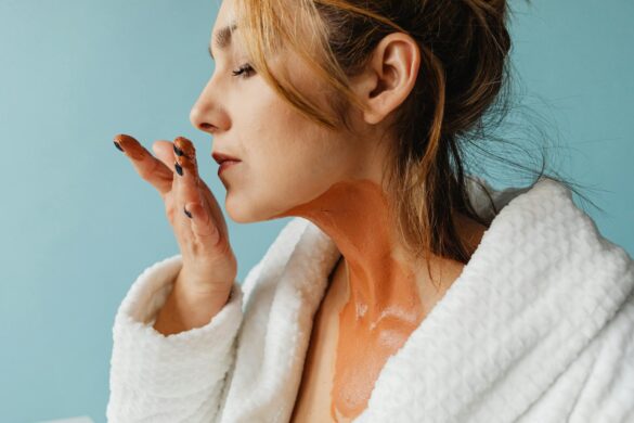 a woman smelling her hand with ointment