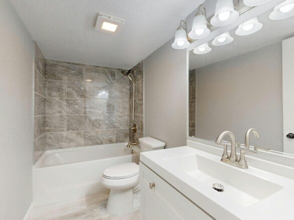 modern bathroom with marble tile and vanity