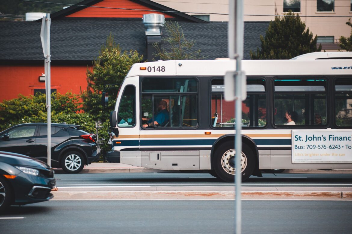 bus and cars on city street