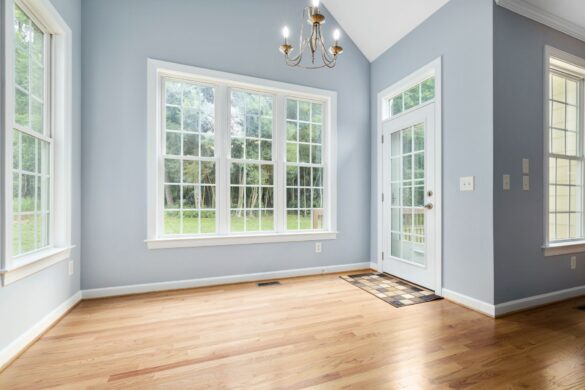 light blue wall with white framed windows
